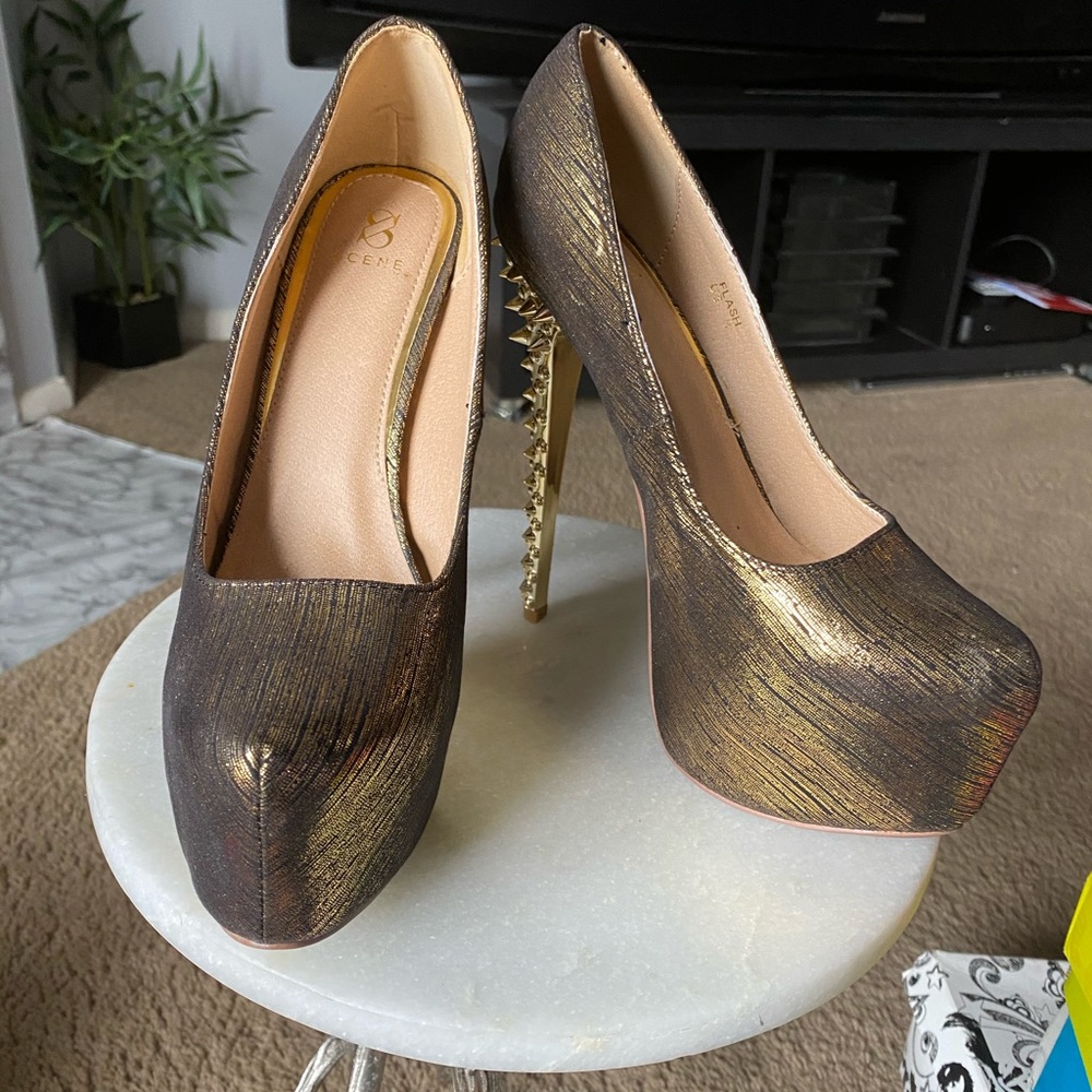Gold spiked heels